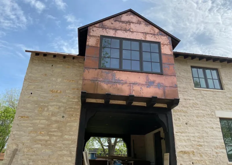 Copper metal panel facade on a stone building for Metal Roof Coating in Suffern